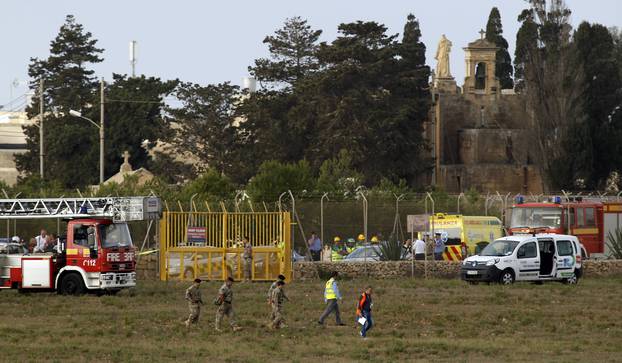 Rescue services at the scene of light aircraft crash at the airport in Malta