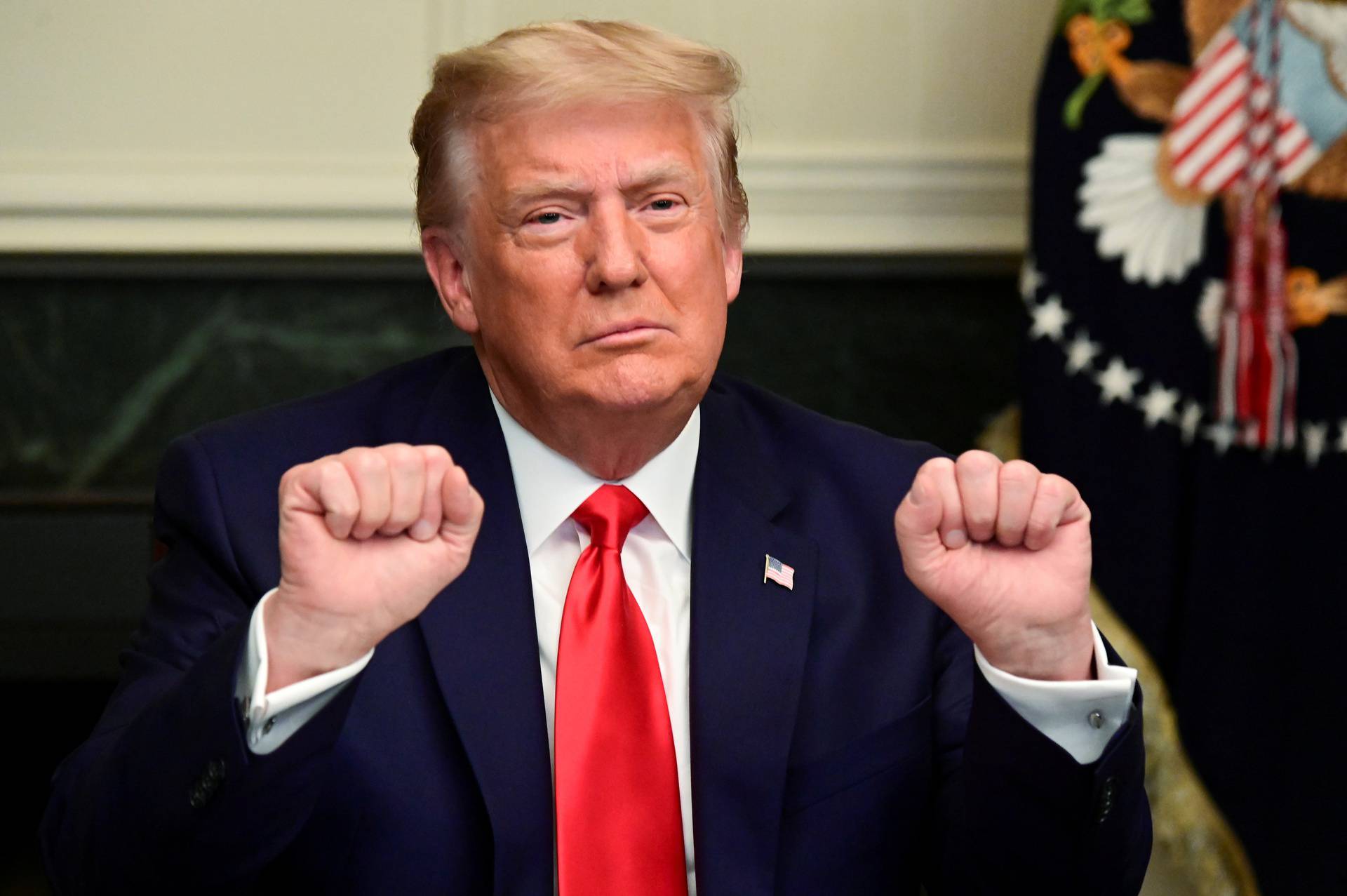 U.S. President Donald Trump participates in a Thanksgiving video teleconference with members of the military forces