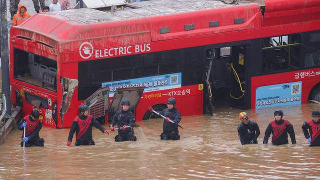 Search and rescue operation at an underpass that has been submerged by a flooded river caused by torrential rain in Cheongju