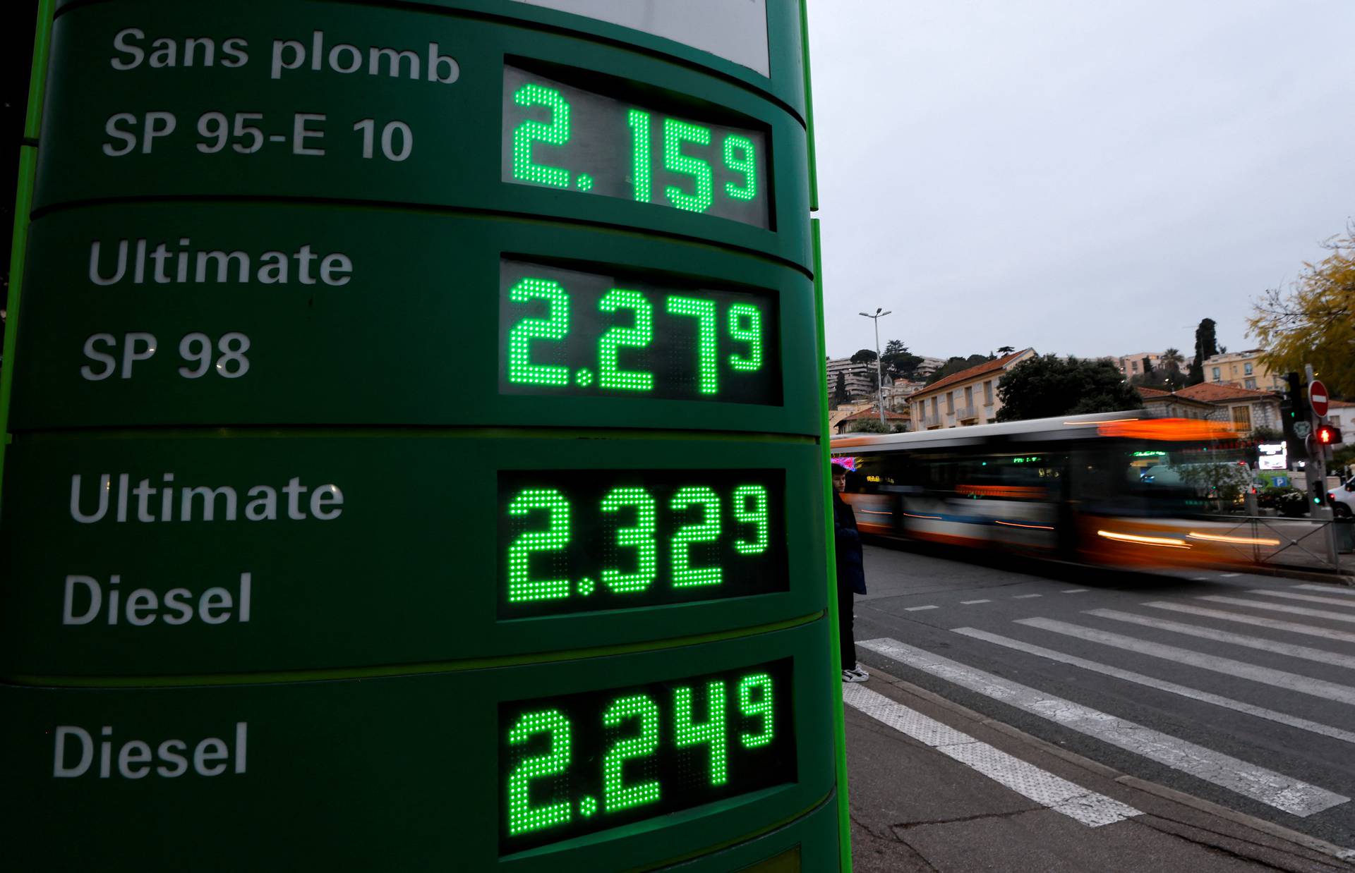 A display shows fuel prices at a petrol station in Nice