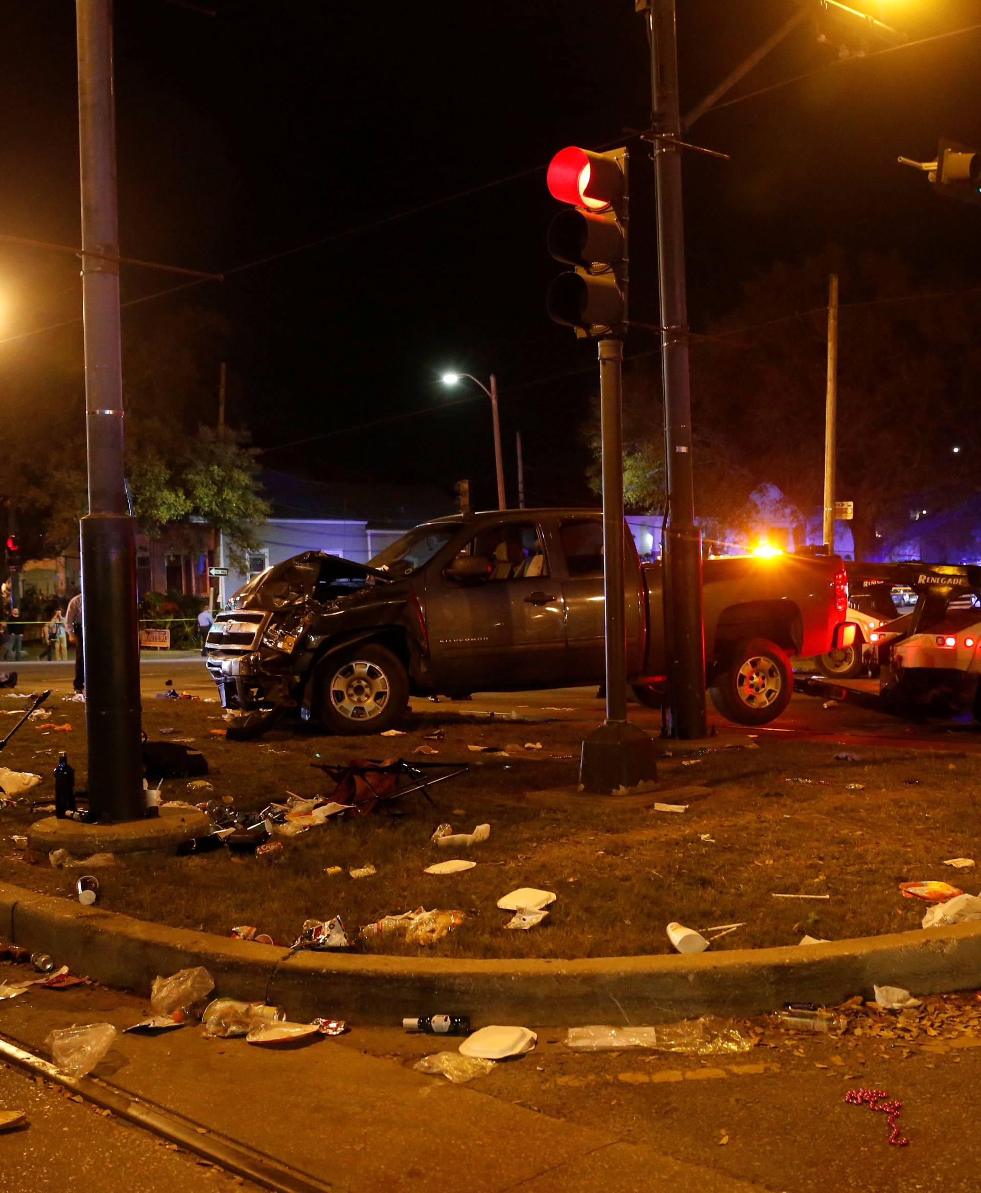 A vehicle is seen crashed along the Endymion parade  route at Orleans and Carollton during Mardi Gras in New Orleans, Louisiana