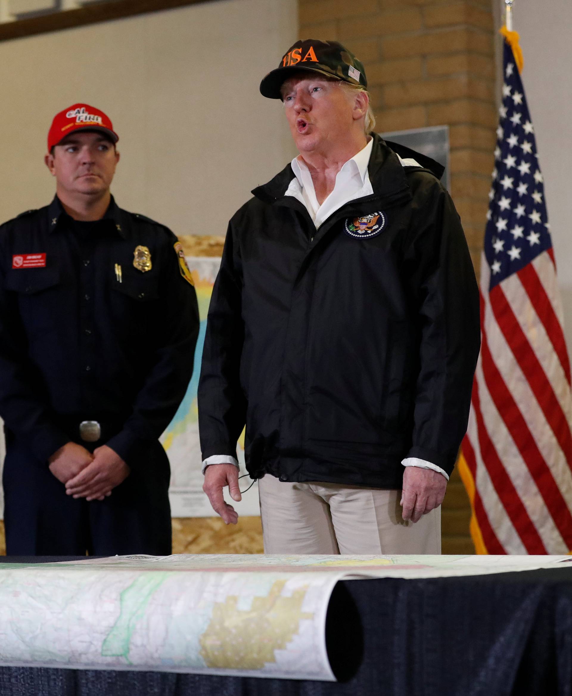 President Donald Trump speaks during a briefing after visiting the charred wreckage of in Paradise California