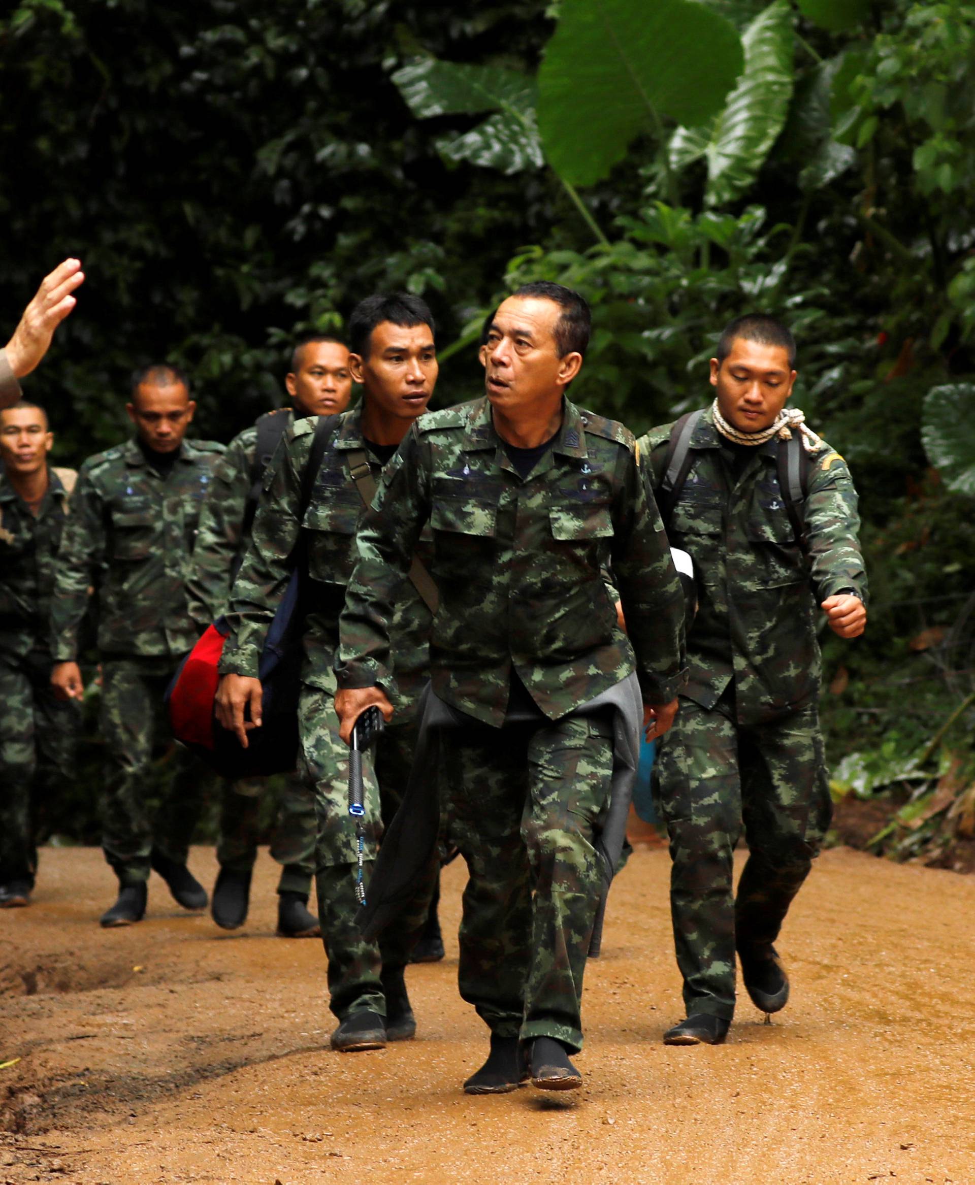 Soldiers arrive outside the Tham Luang cave complex, where 12 schoolboys and their soccer coach are trapped inside a flooded cave, in the northern province of Chiang Rai