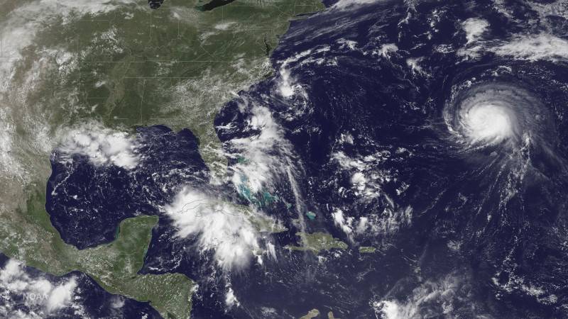 Handout photo of satellite image of three storm systems shown in the Atlantic Ocean