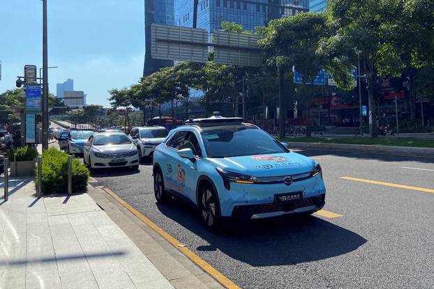 Car with autonomous driving system by Alibaba-backed DeepRoute.ai, drives on a street in Shenzhen