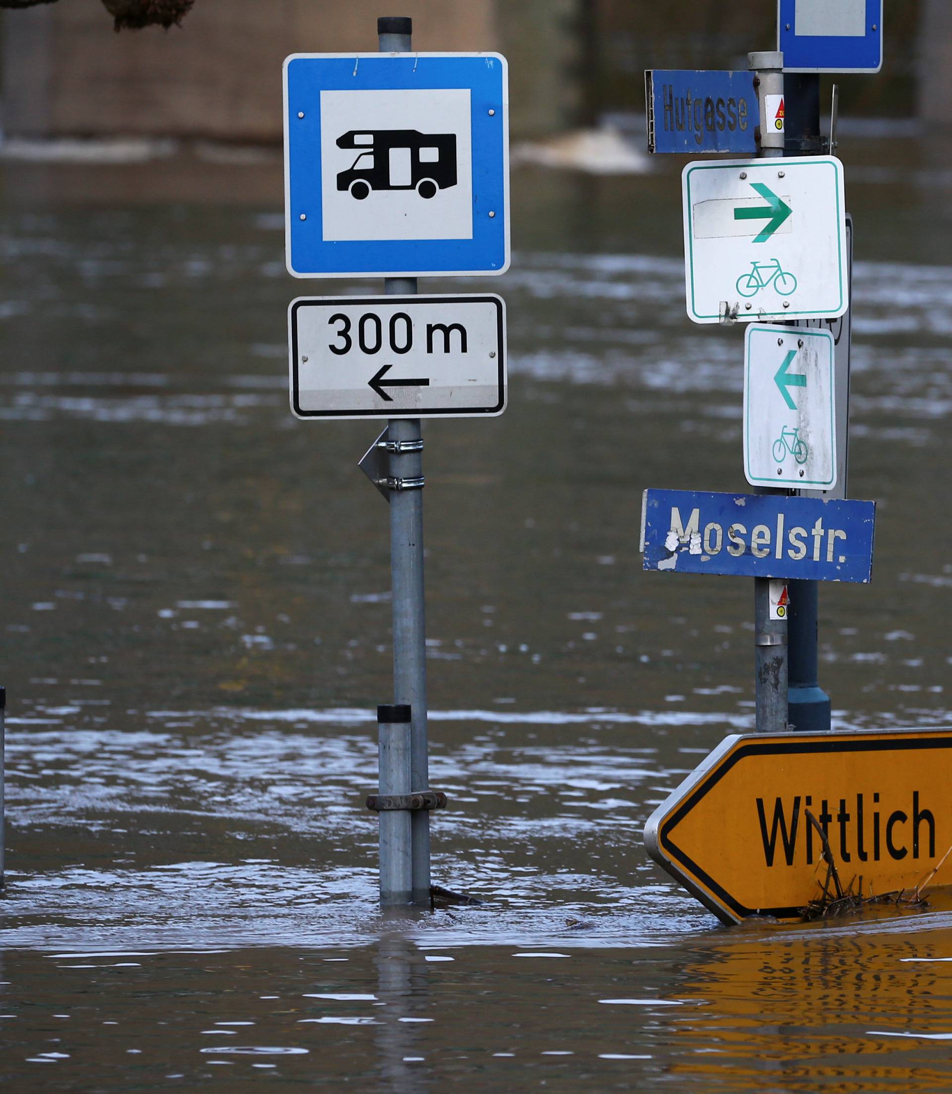 The street sign for the Moselle street is flooded by the river Moselle in Reil