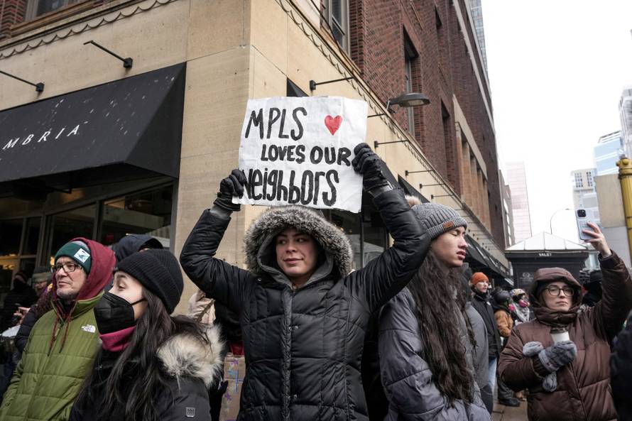 People attend the "March Against Minnesota Fraud" in Minneapolis
