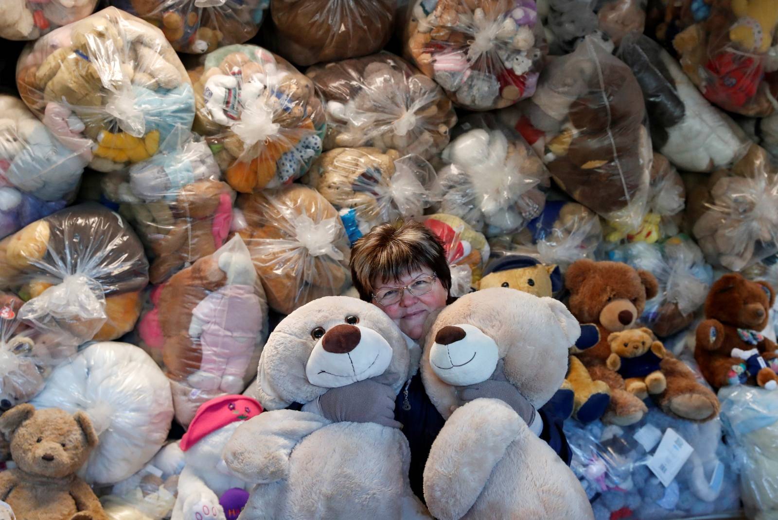 Valeria Schmidt, nicknamed as "Teddy Bear Mama", hugs teddy bears in Harsany