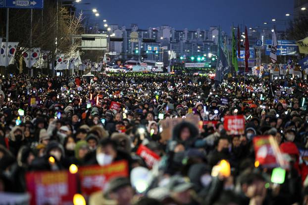 Protesters take part in a rally calling for the impeachment of South Korean President Yeol, in Seoul