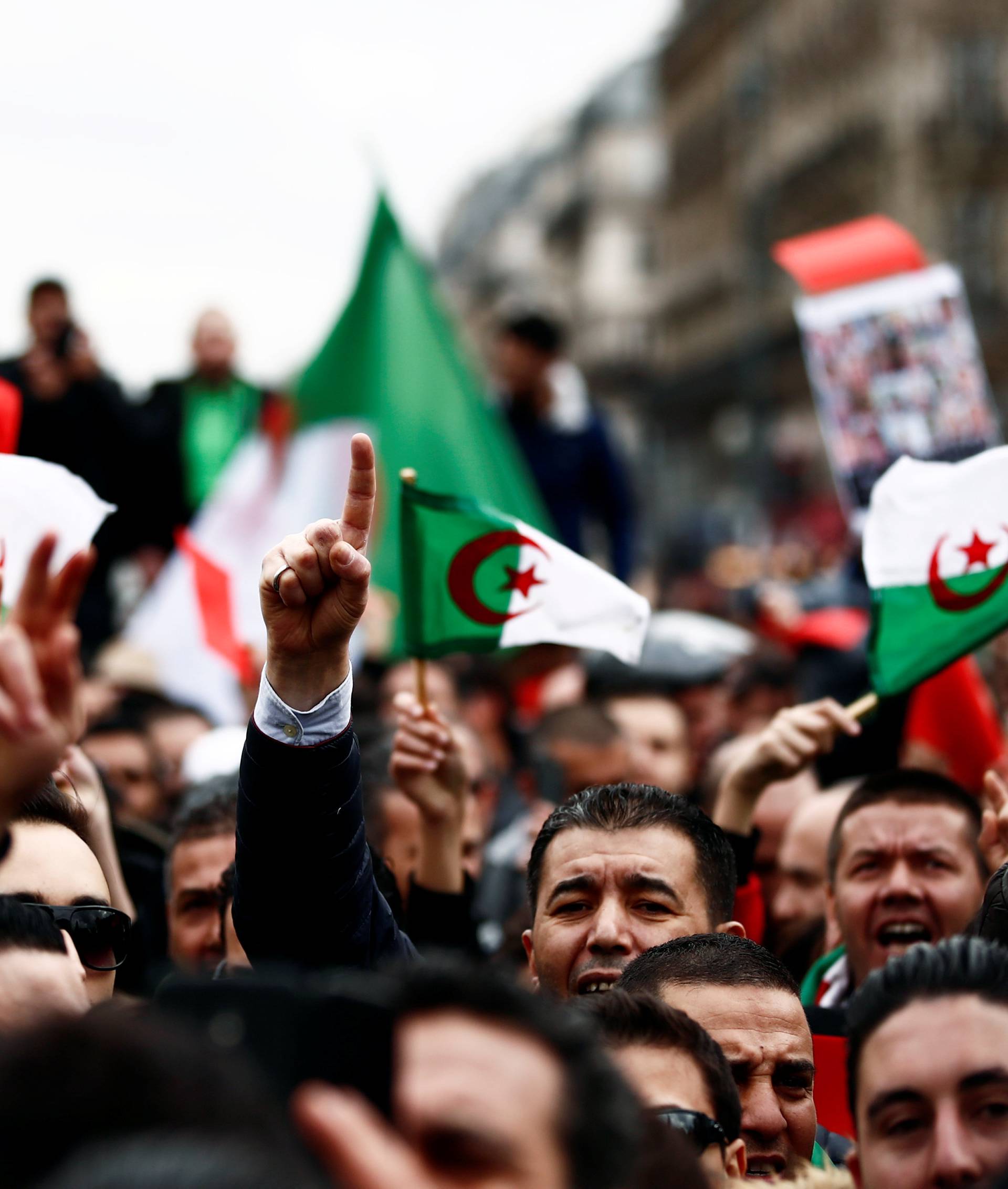 Demonstrators gather near the Monument to the Republic during a protest against Algerian President Abdelaziz Bouteflika seeking a fifth term in a presidential election in Paris