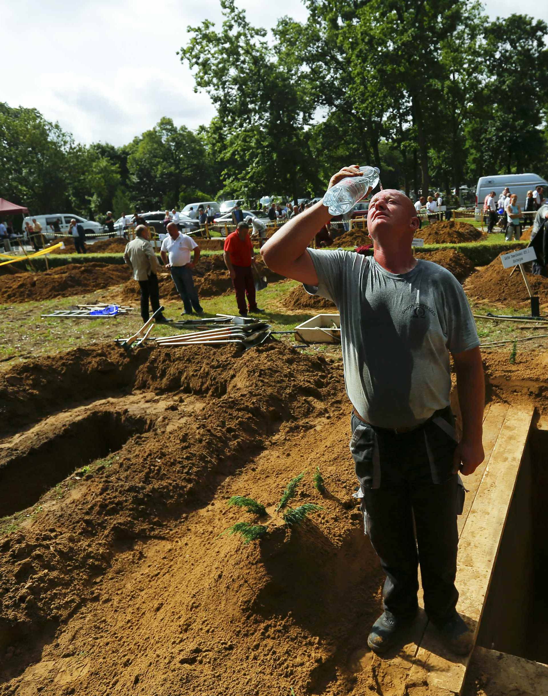 Gravedigger competes in Hungarian grave digging championship in Debrecen