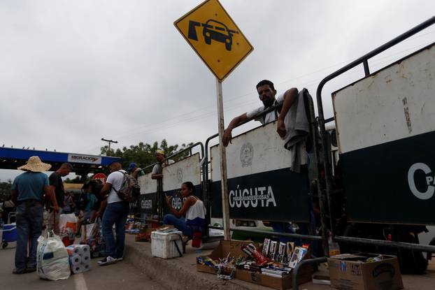 A man sells cookies and treats at the Simon Bolivar international bridge in Cucuta