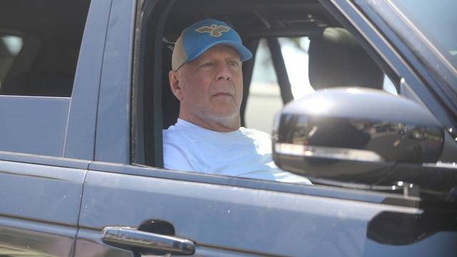 *EXCLUSIVE* Bruce Willis looking healthy and observing people on the street while out for a ride with a friend