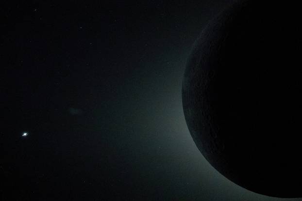 A portion of the Moon backlit by the Sun during the Artemis II crew’s flyby of the Moon