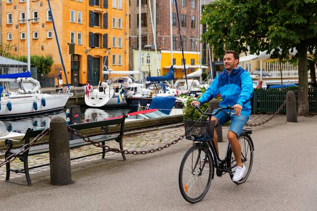 Cyclist,On,Copenhagen,Bike,Lane,Near,Canal