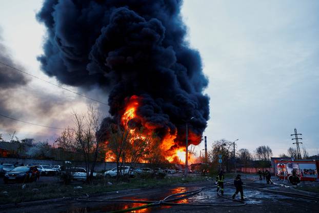 Rescuers work at the site of a Russian missile strike, amid Russia's attack on Ukraine, in Kyiv