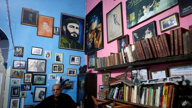 A man poses for a picture after the death of Cuba's former President Fidel Castro was announced in Havana, Cuba