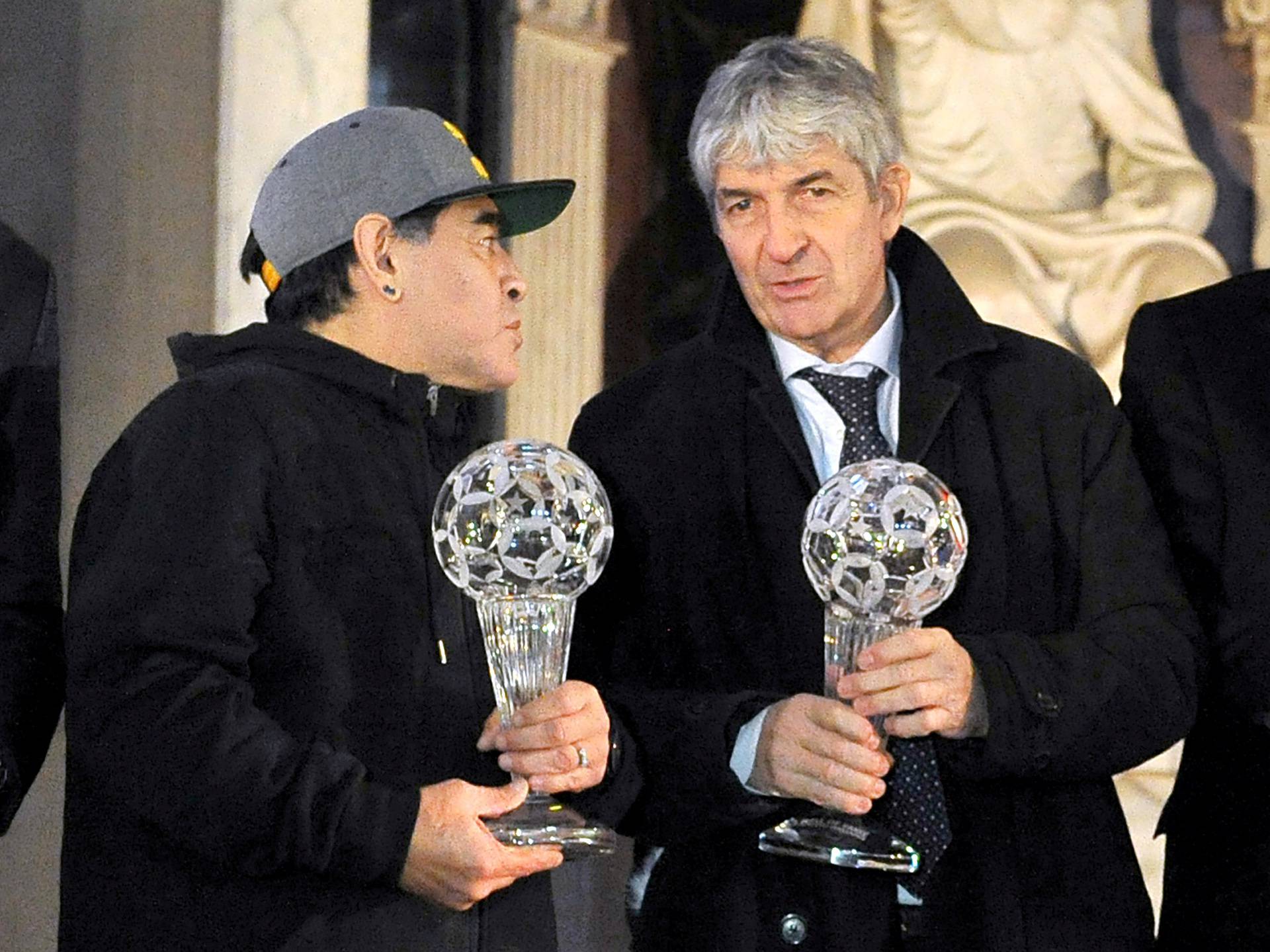 Diego Maradona and Paolo Rossi pose for a photo as they attend the Italian football hall of fame awards ceremony