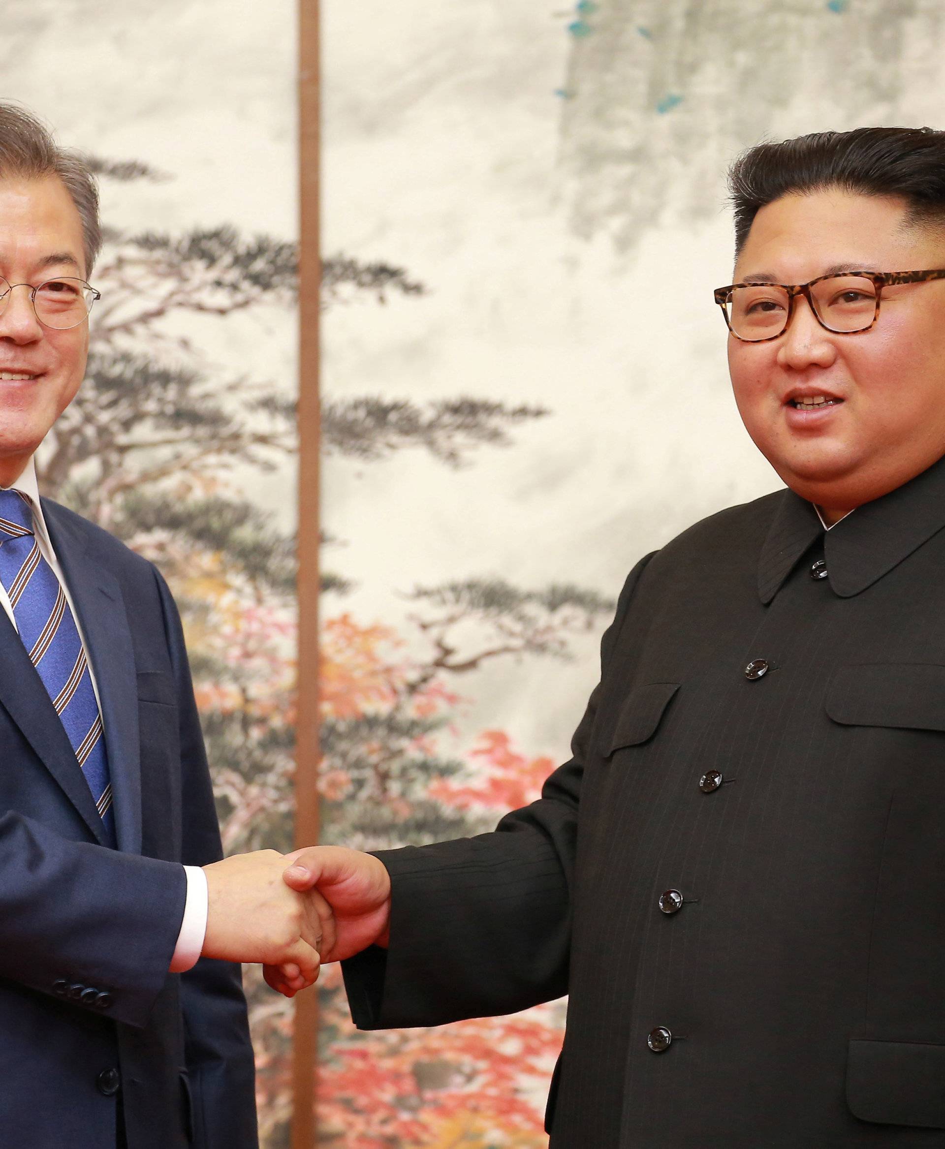 South Korean President Moon Jae-in and North Korean leader Kim Jong Un shake hands during their joint news conference in Pyongyang in this photo released by North Korea's Korean Central News Agency