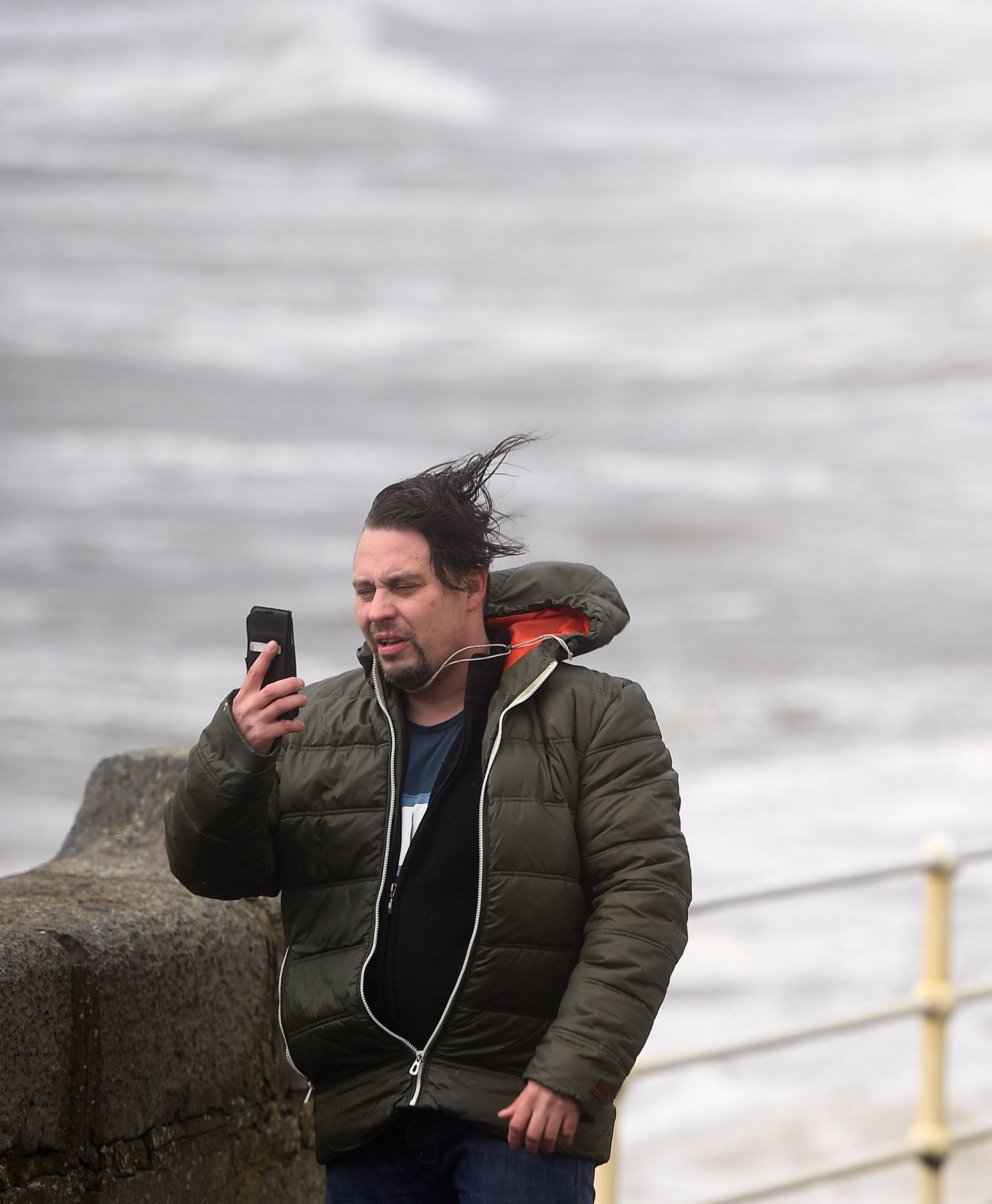 A man takes a selfie during storm Ophelia in the County Clare town of Lahinch