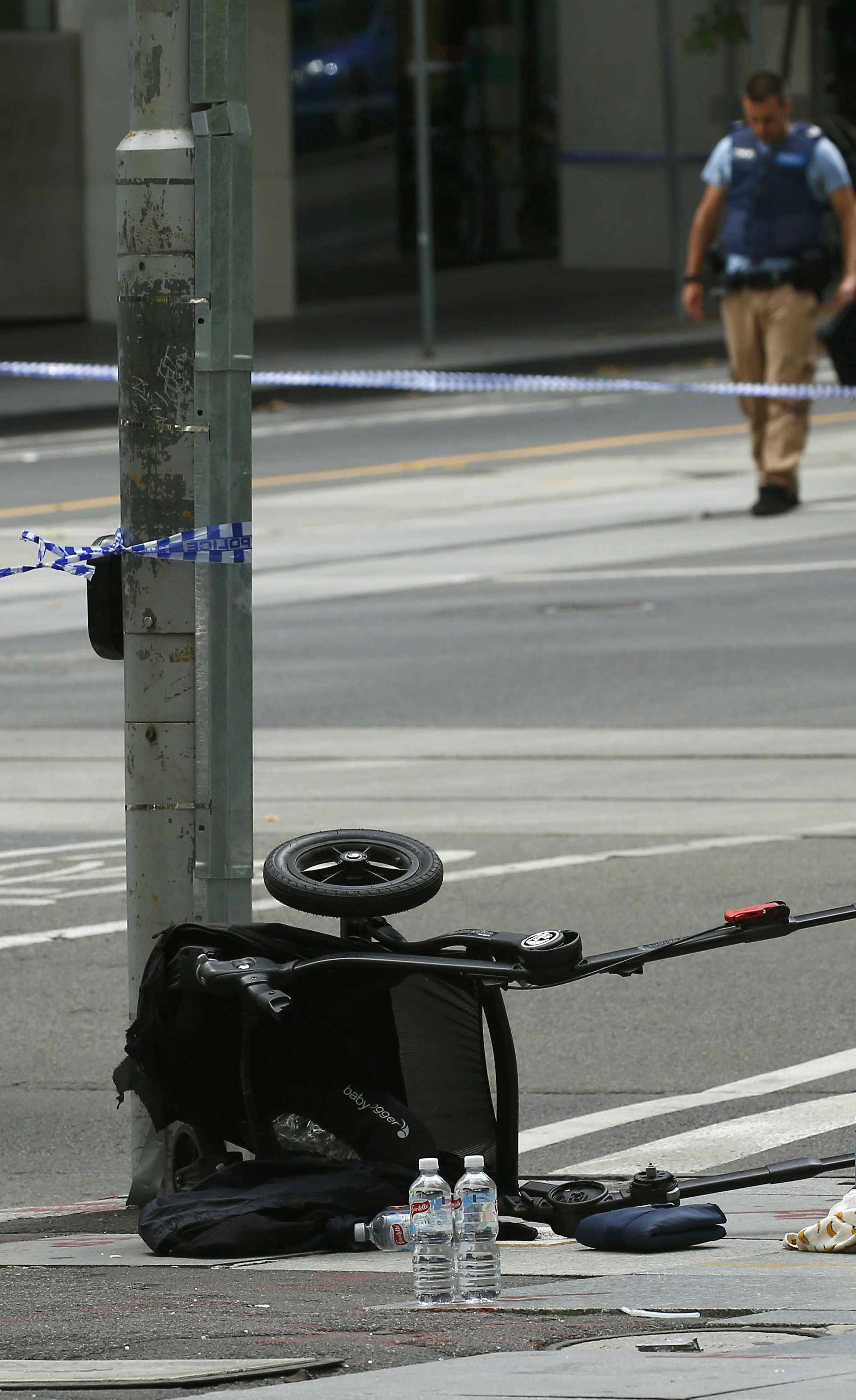 A pram is seen as police cordon off Bourke Street mall, after a car hit pedestrians in central Melbourne