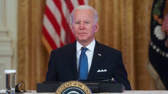 U.S. President Joe Biden listens to a question from Fox News reporter Peter Doocy