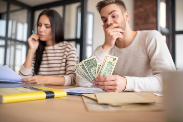 Husband feeling shocked realizing the amount of taxes to pay