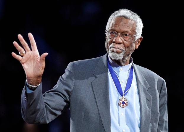 FILE PHOTO: Celtics' legend Russell stands with his Presidential Medal of Freedom during the NBA All-Star basketball game in Los Angeles