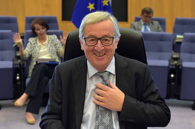 EC President Juncker gestures before a meeting of the College of Commissioners in Brussels