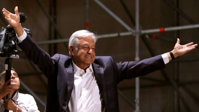 Mexico's next President Andres Manuel Lopez Obrador gestures to supporters, in Mexico City