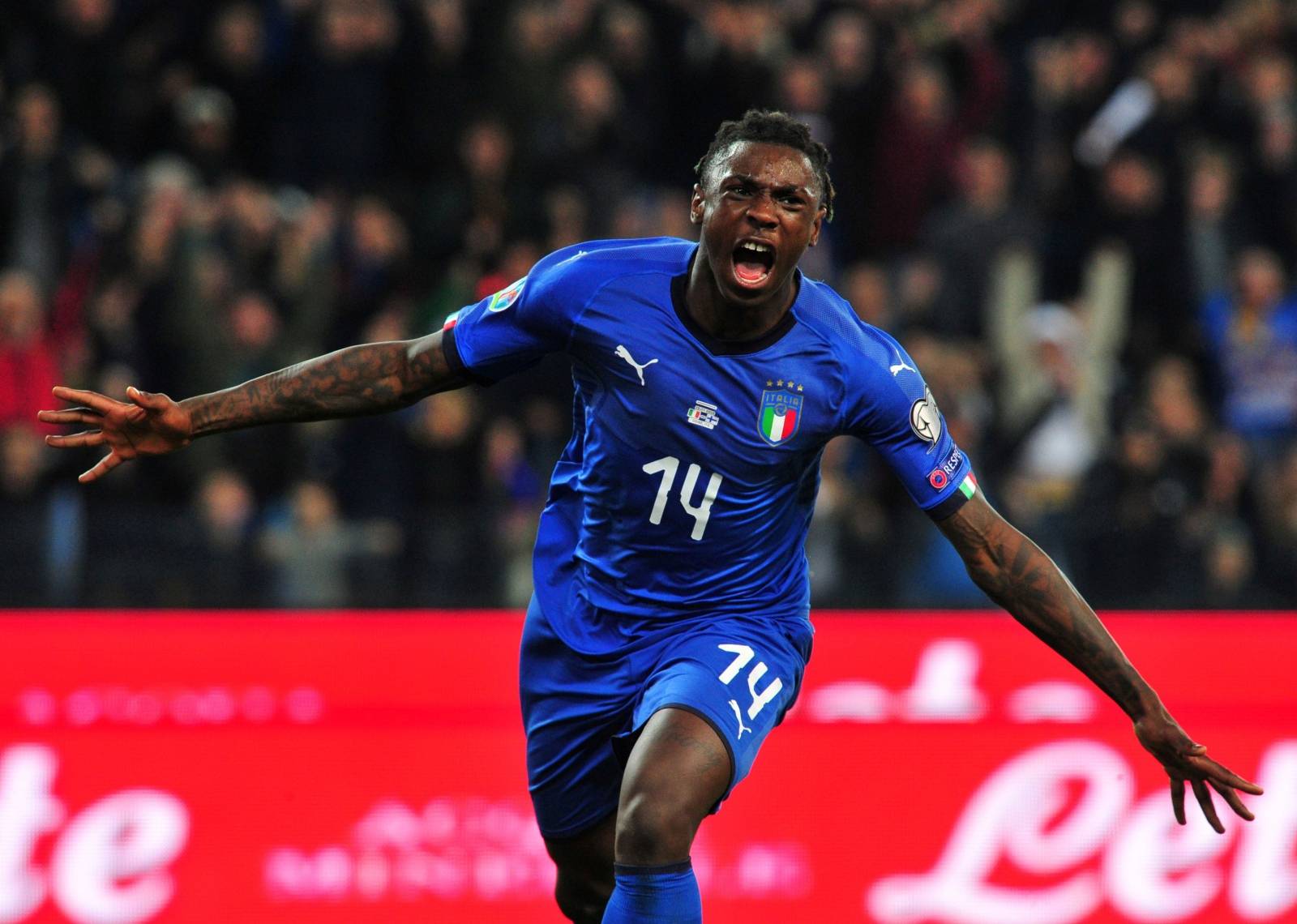 FILE PHOTO: Italy striker Moise Kean celebrates scoring their second goal in a European championship qualifying game against Finland.