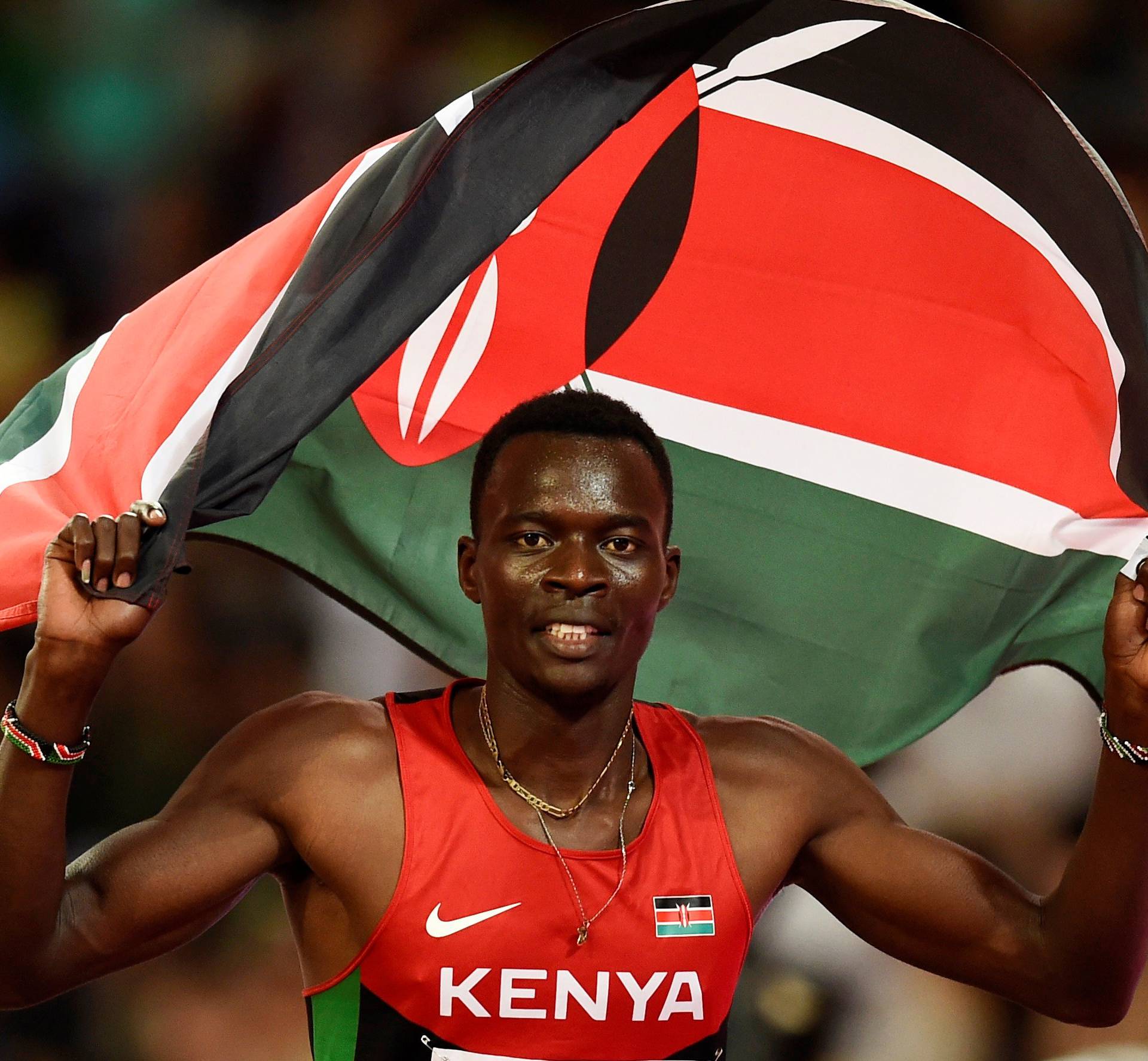 FILE PHOTO: Nicholas Bett of Kenya celebrates with his national flag after winning the men's 400 metres hurdles final during the 15th IAAF World Championships at the National Stadium in Beijing
