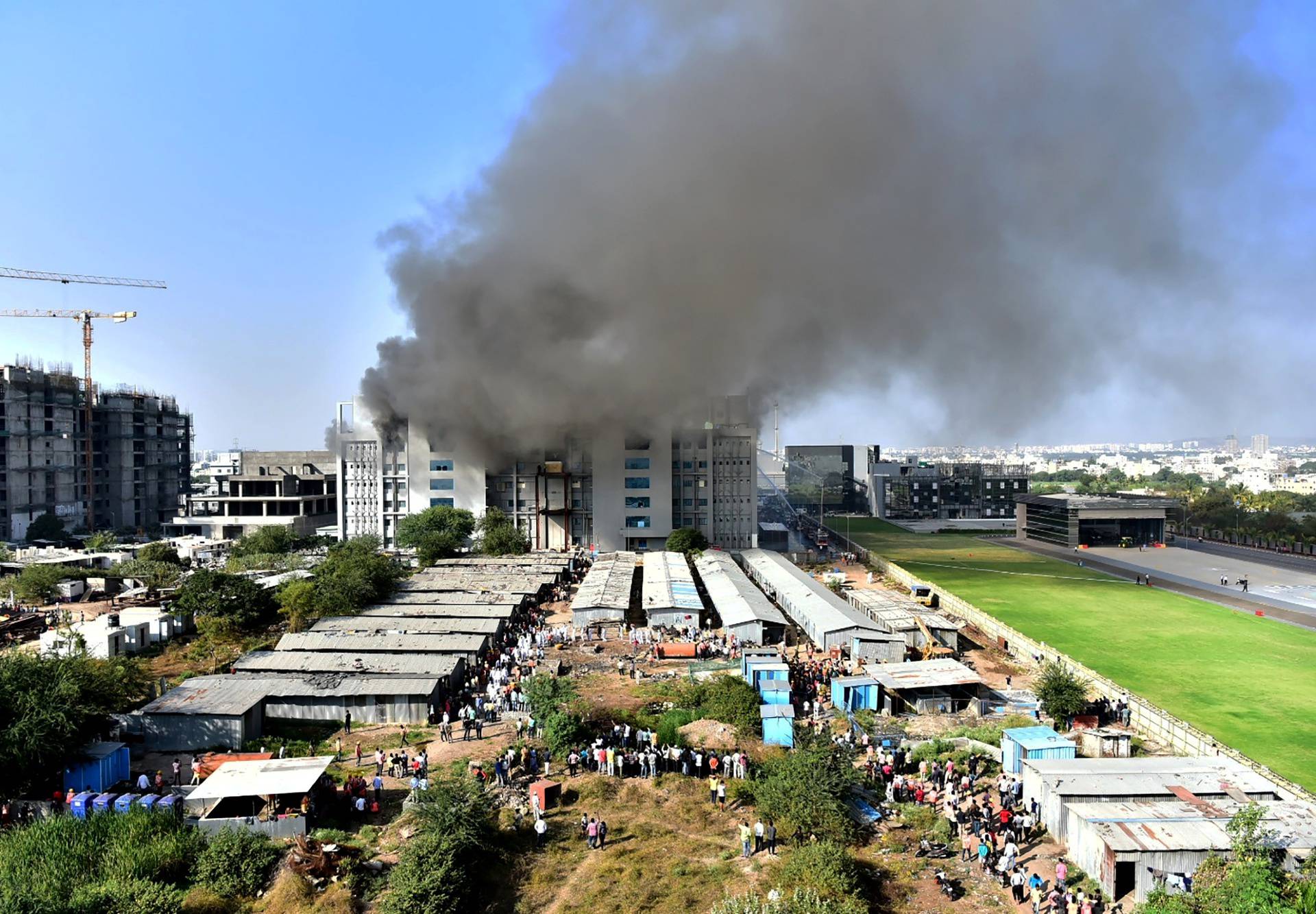 Smoke billows after a fire broke out inside the complex of the Serum Institute of India, in Pune