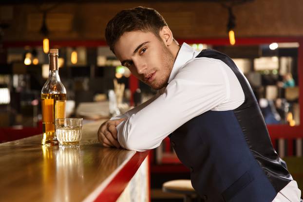 Shots of a handsome man relaxing at the bar 