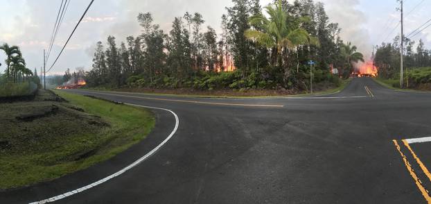 A crack opens up on Pohoiki Road, Lava near Leilani Estates, on Kilauea Volcano