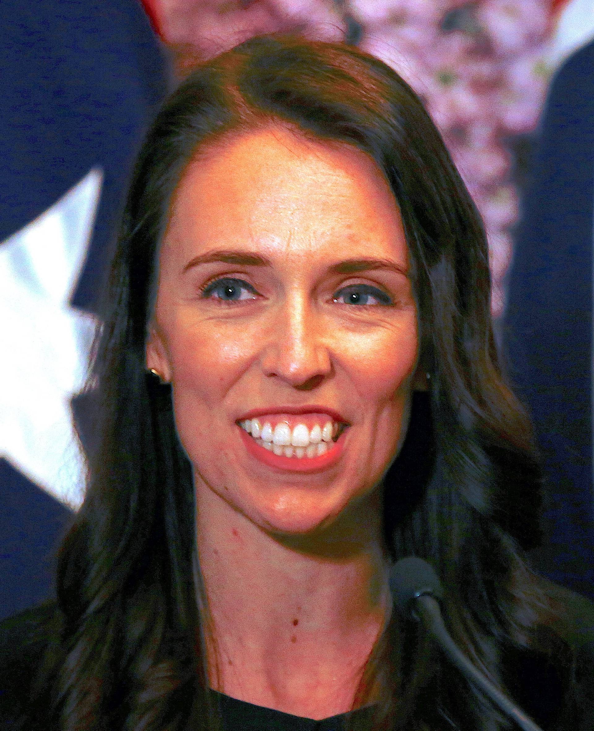 FILE PHOTO - New Zealand Prime Minister Jacinda Ardern smiles as she answers a question during a media conference in Sydney