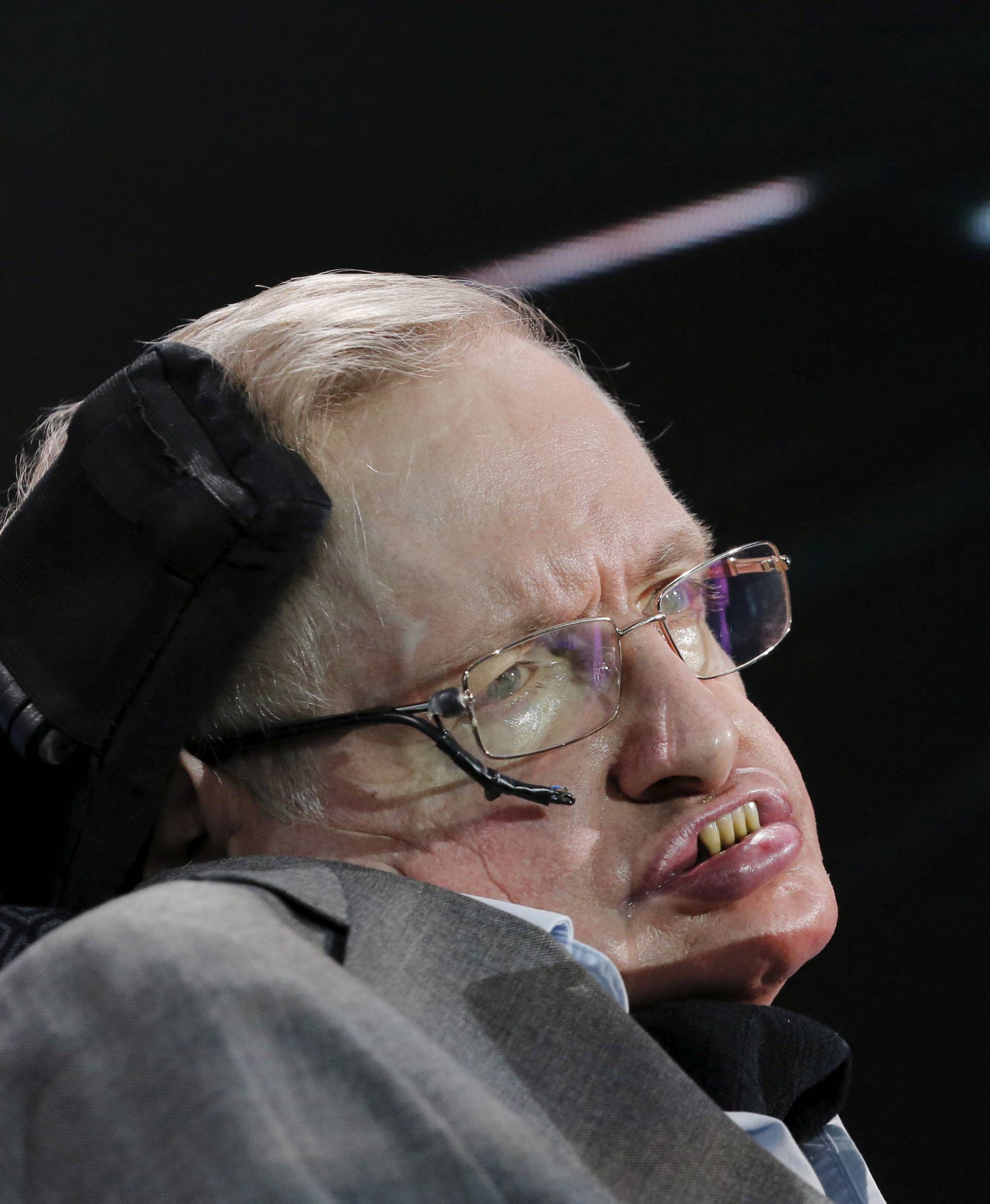 FILE PHOTO: Physicist Stephen Hawking sits on stage during an announcement of the Breakthrough Starshot initiative with investor Yuri Milner in New York