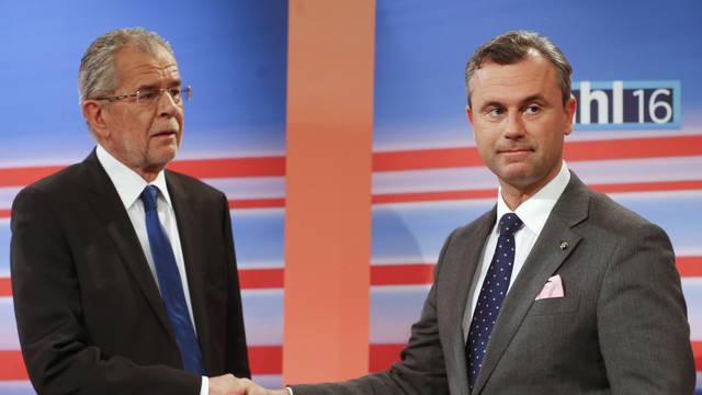 Presidential candidates Hofer and Van der Bellen shake hands before TV debate after Austrian presidential election in Vienna