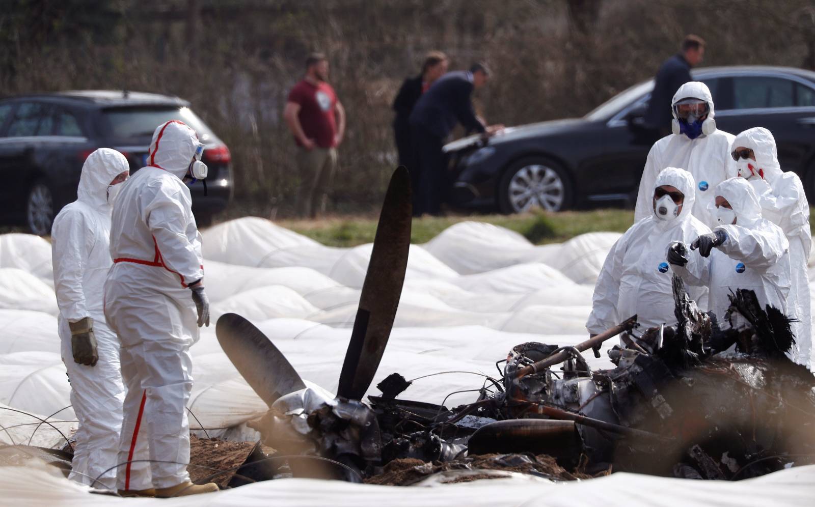 Experts from Germany and Russia inspect the wreckage of an Epic1000 plane in which Natalia Fileva, co-owner and chairwoman of Russia's second largest airline S7, was killed after the plane crashed in Erzhausen near Frankfurt