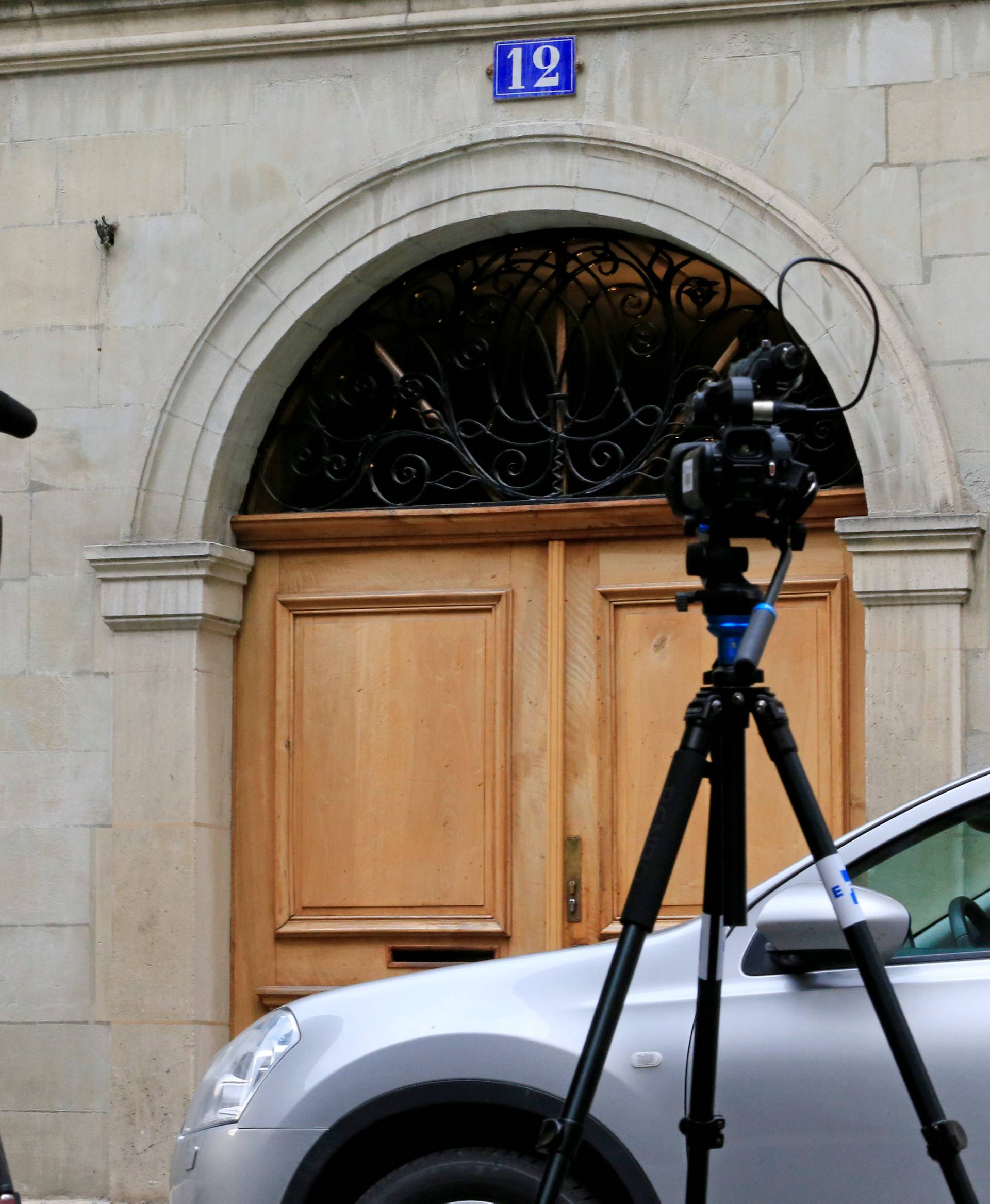 Journalists stand outside residence of Spain's Princess Cristina, sister of King Felipe VI in Geneva