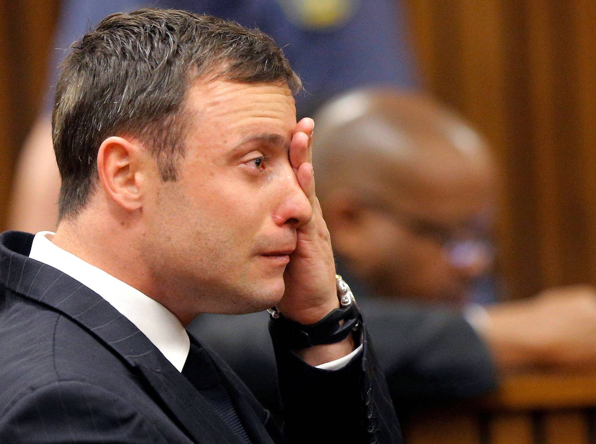 FILE PHOTO: Olympic and Paralympic track star Pistorius reacts as he listens to Judge Masipa's judgement at the North Gauteng High Court in Pretoria