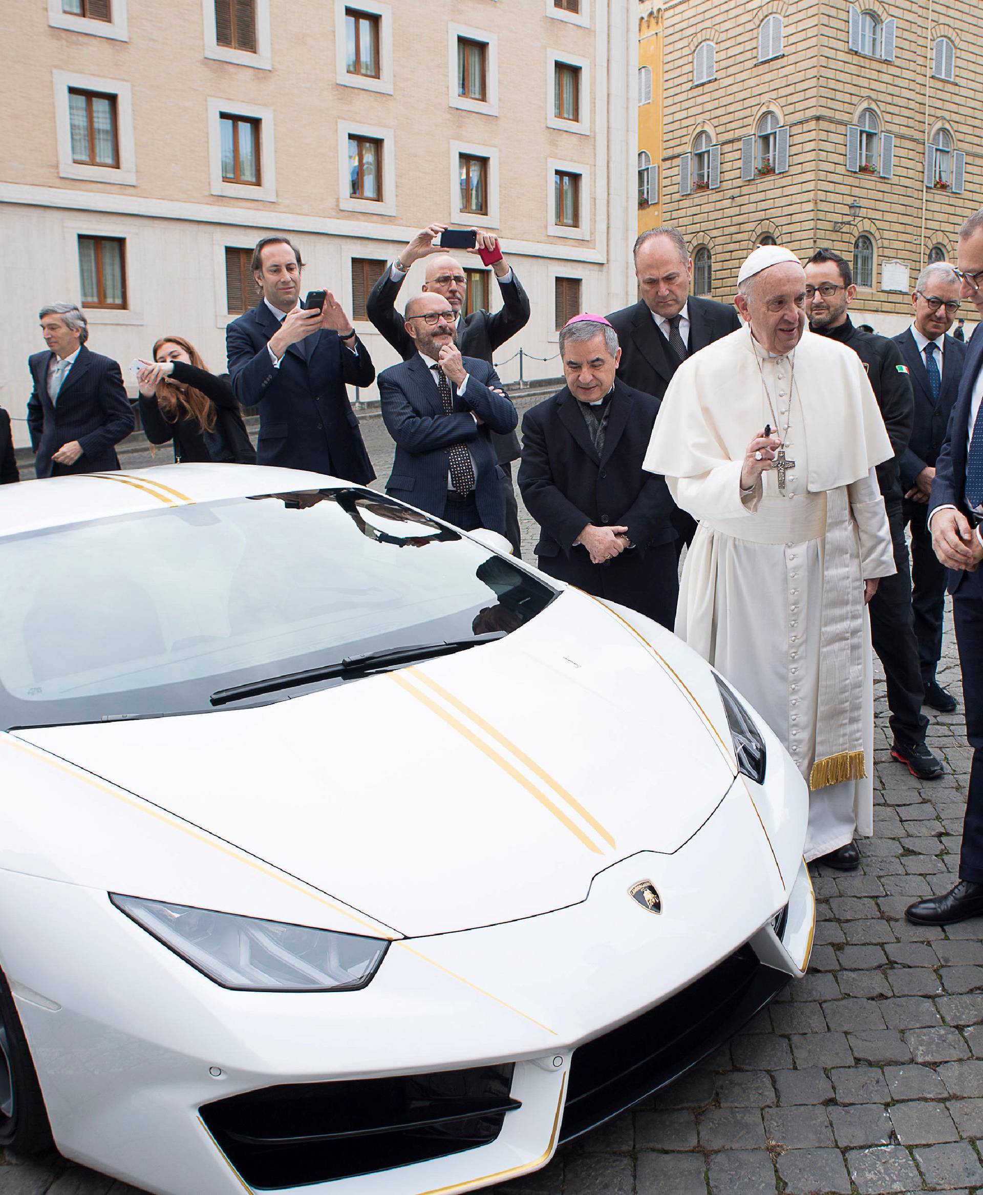 Pope Francis receives a Lamborghini Huracan prior to his Wednesday general audience in Saint Peter's square at the Vatican