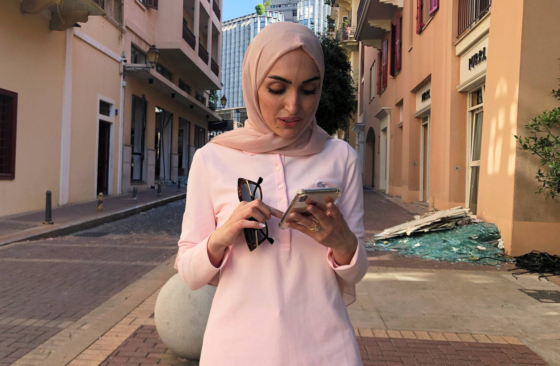 Bride Israa Seblani poses for a picture in the same place where she was taking her wedding photos yesterday at the moment of the explosion that occurred at Beirut's port area
