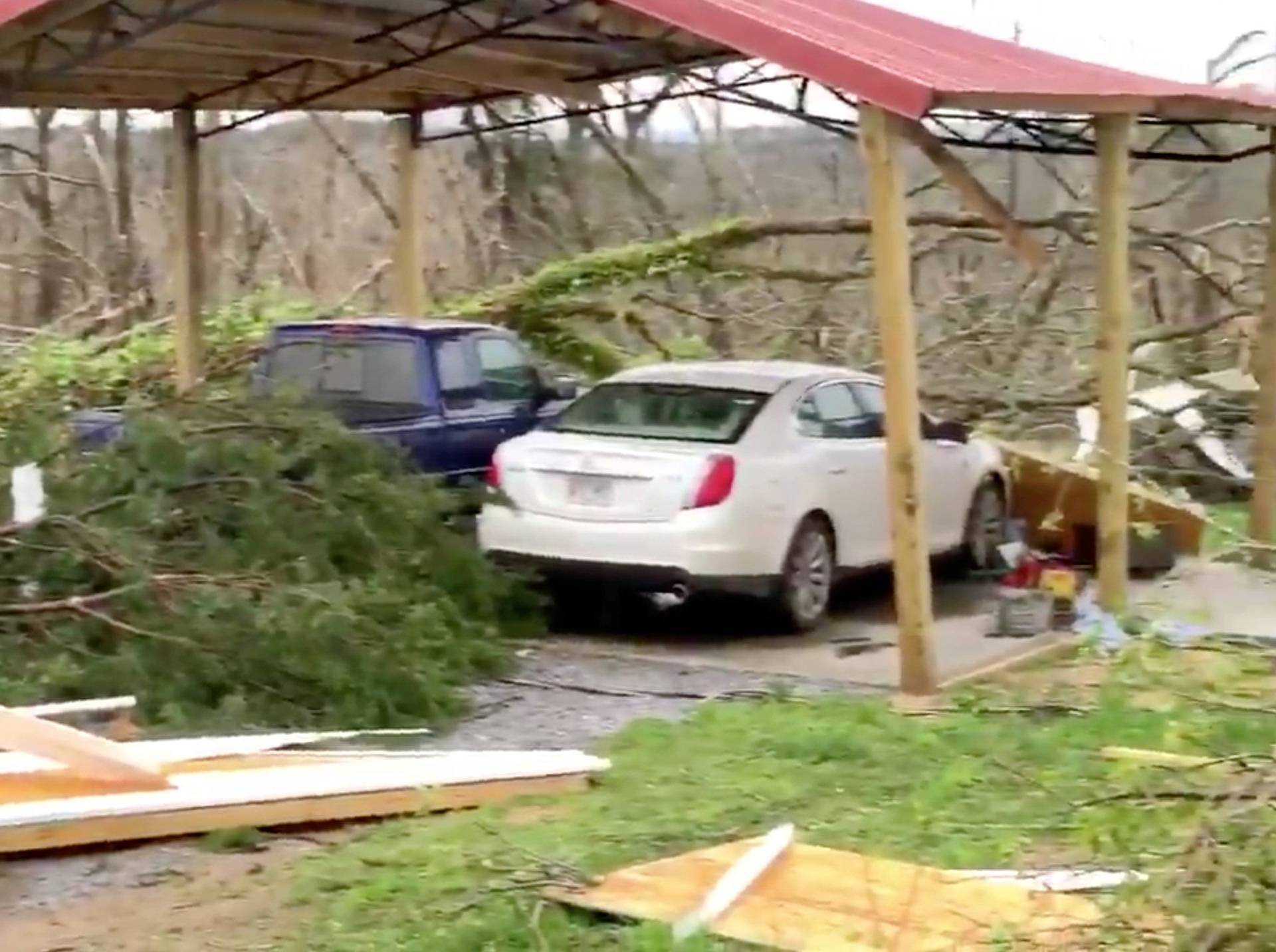 Damaged vehicles in a shelter next to debris following a tornado in Beauregard, Alabama, U.S. in this March 3, 2019 still image obtained from social media video