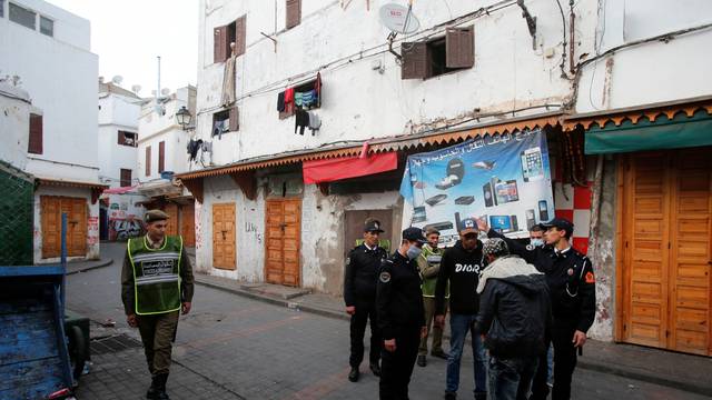 FILE PHOTO: Police officers patrol streets in the old Medina in Casablanca