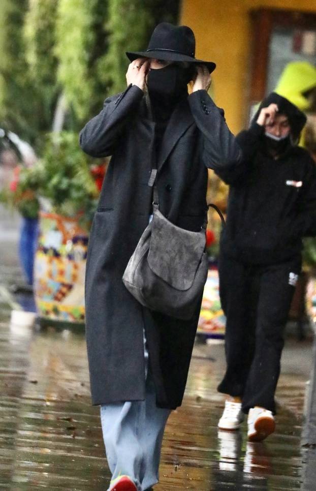 *EXCLUSIVE* Cameron Diaz and Benji Madden go shopping in the rain together in Beverly Hills