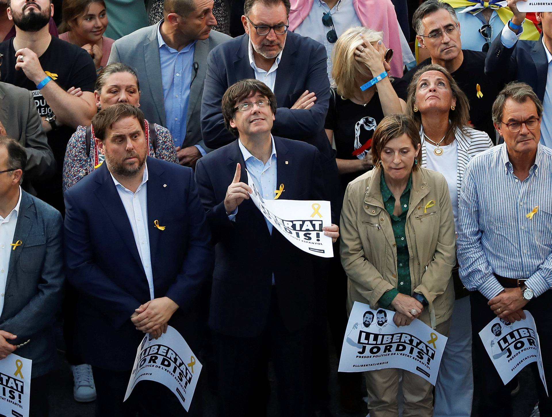 Catalan President Puigdemont and other government members attend a demonstration organised by Catalan pro-independence movements ANC (Catalan National Assembly) and Omnium Cutural, following the imprisonment of their two leaders in Barcelona