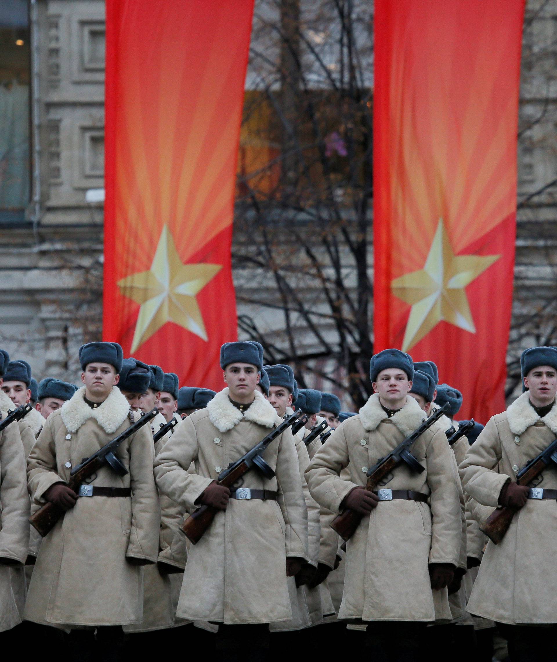 Russian servicemen dressed in historical uniforms wait before a military parade marking the anniversary of the 1941 parade, when Soviet soldiers marched towards the front lines of World War Two, at Red Square in Moscow