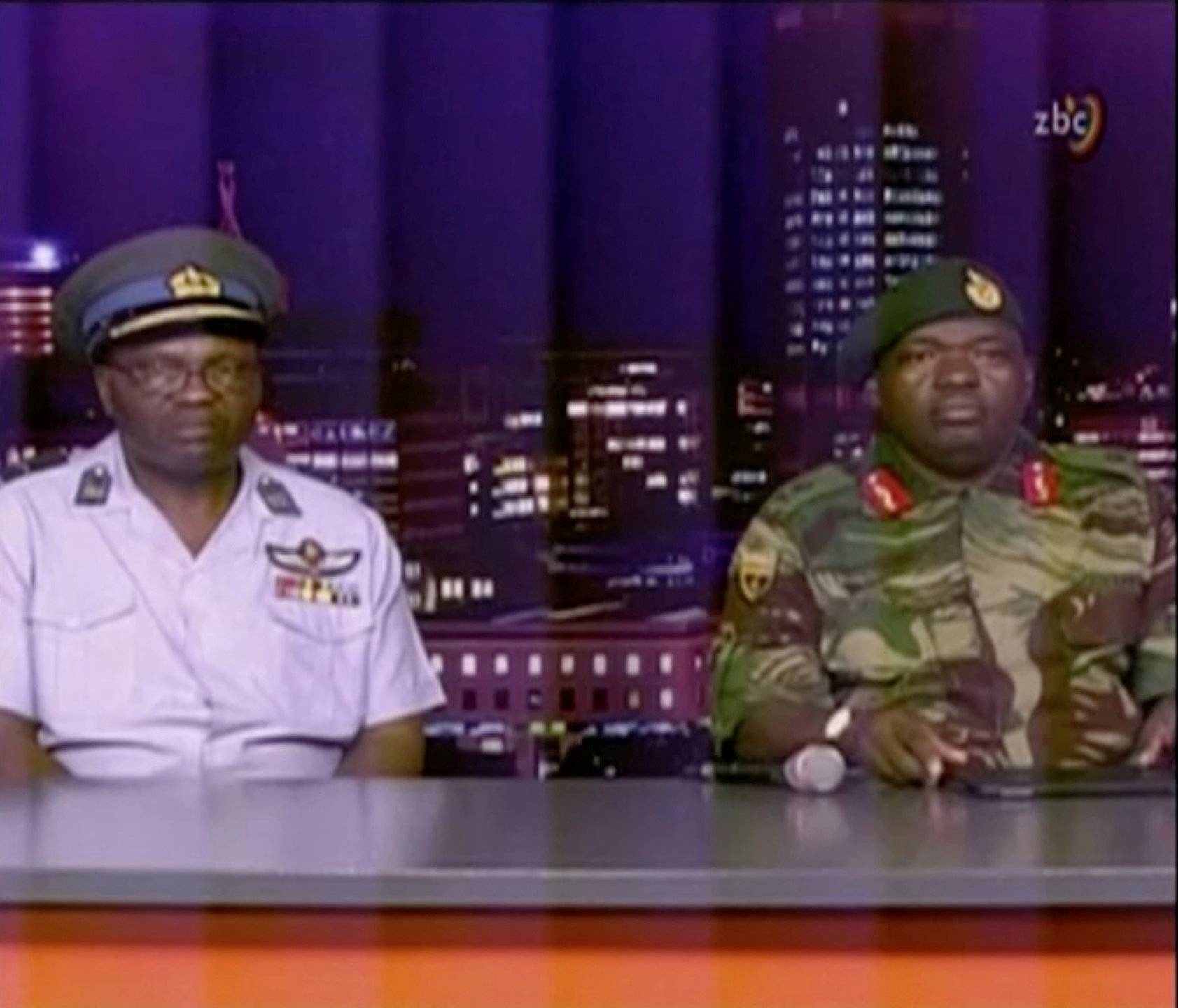 Zimbabwe Defence Forces Major-General Moyo makes an announcement on state broadcaster ZBC
