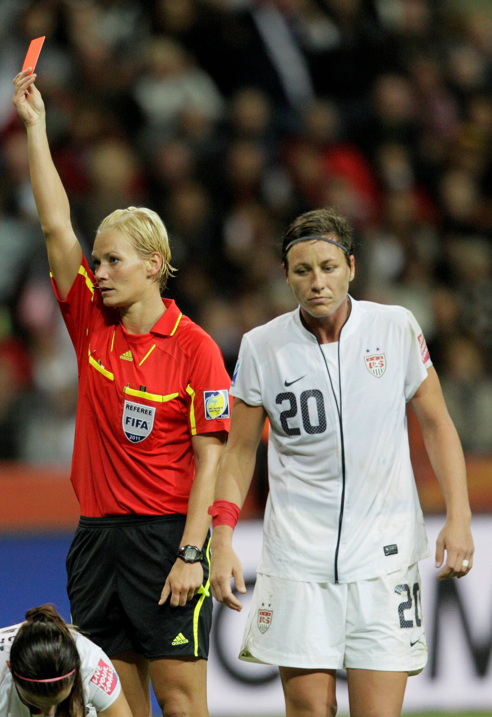 FILE PHOTO: Referee Steinhaus of Germany shows a red card to Iwashimizu of Japan during the Women's World Cup final soccer match between Japan and the U.S. in Frankfurt